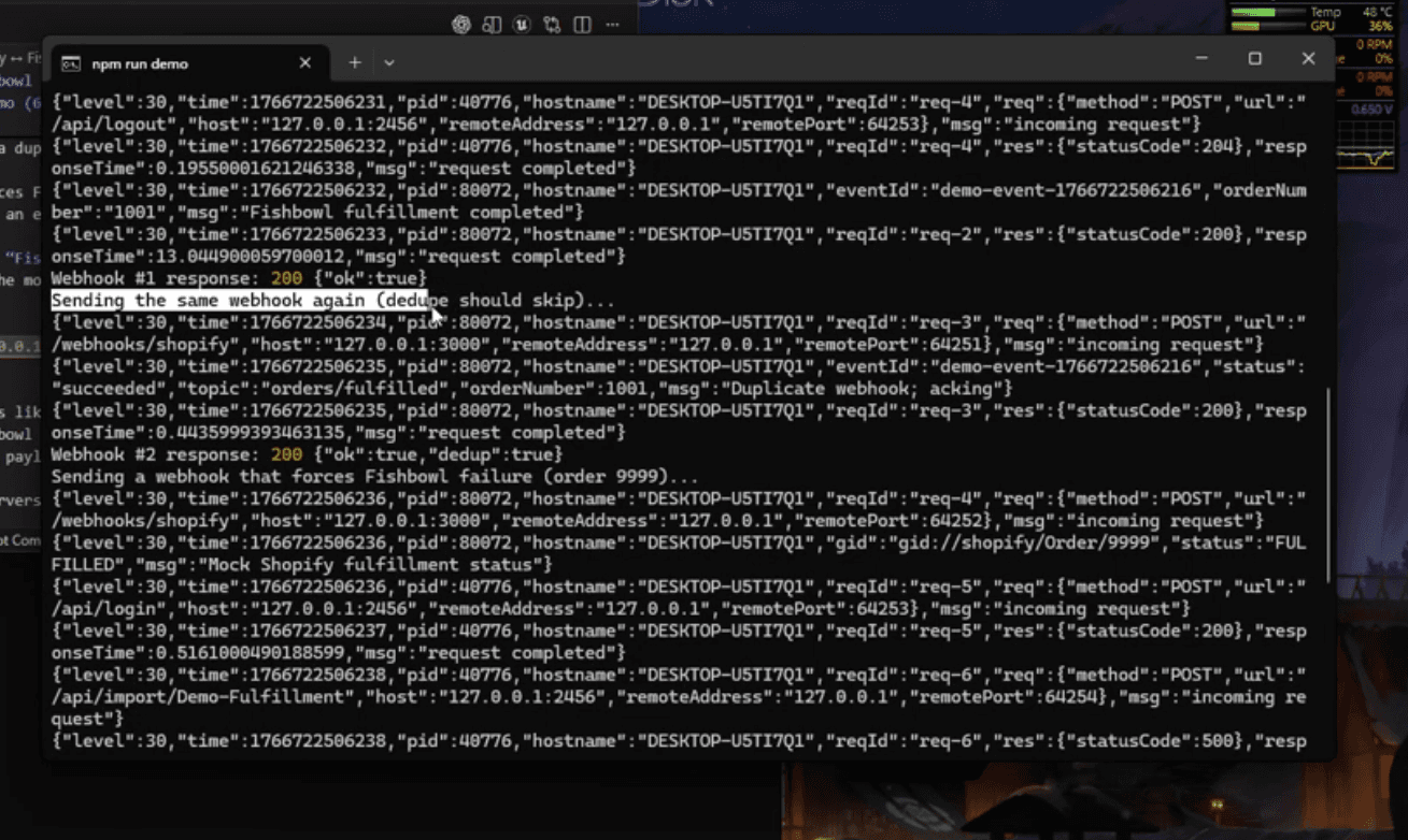 Console output of demo run of shopify-fishbowl fulfillment bridge showing success + dedupe + failure path